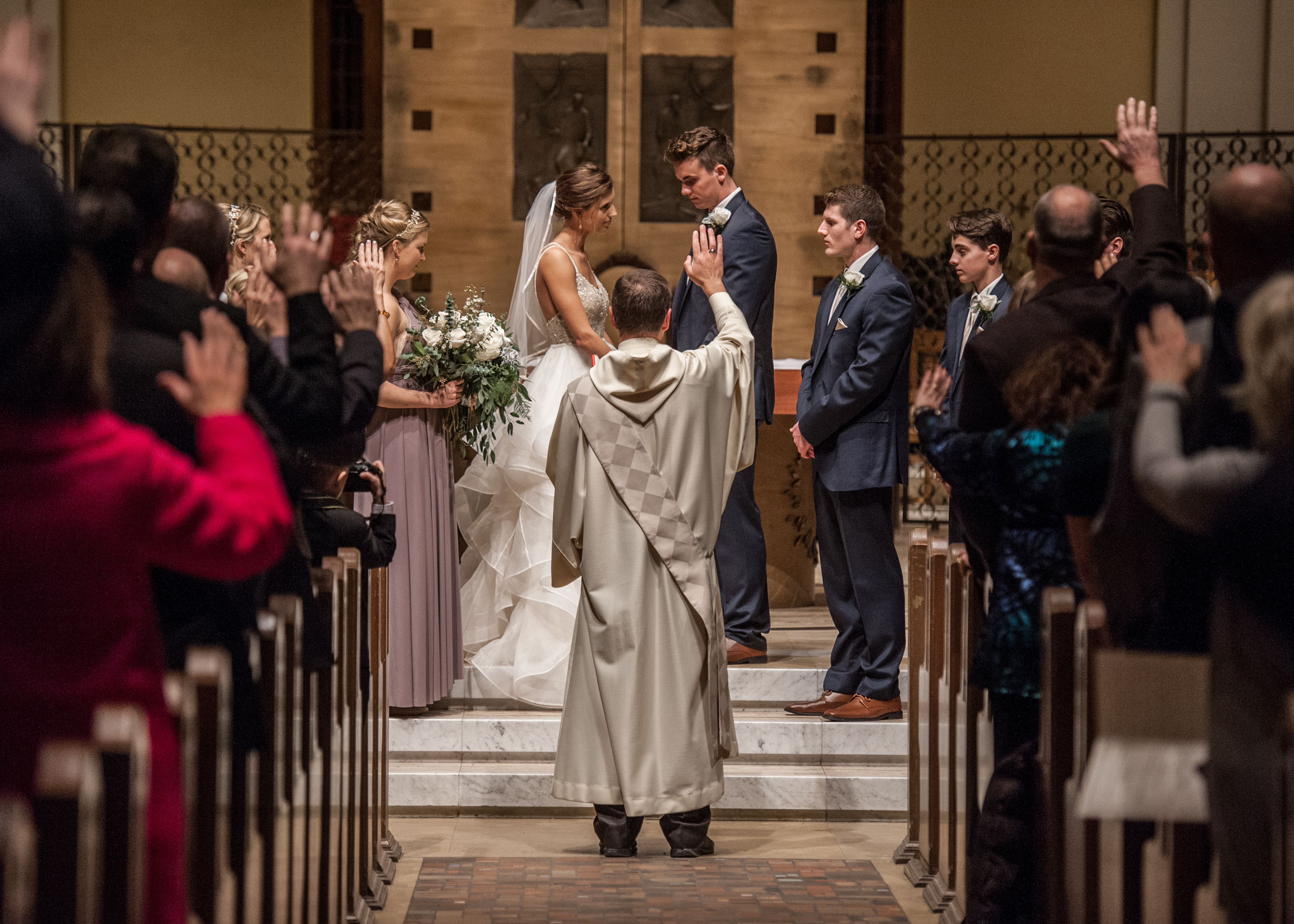 two people get married in the Chapel of St. Thomas Aquinas